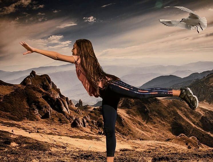 Girl in Mountains with Openhand